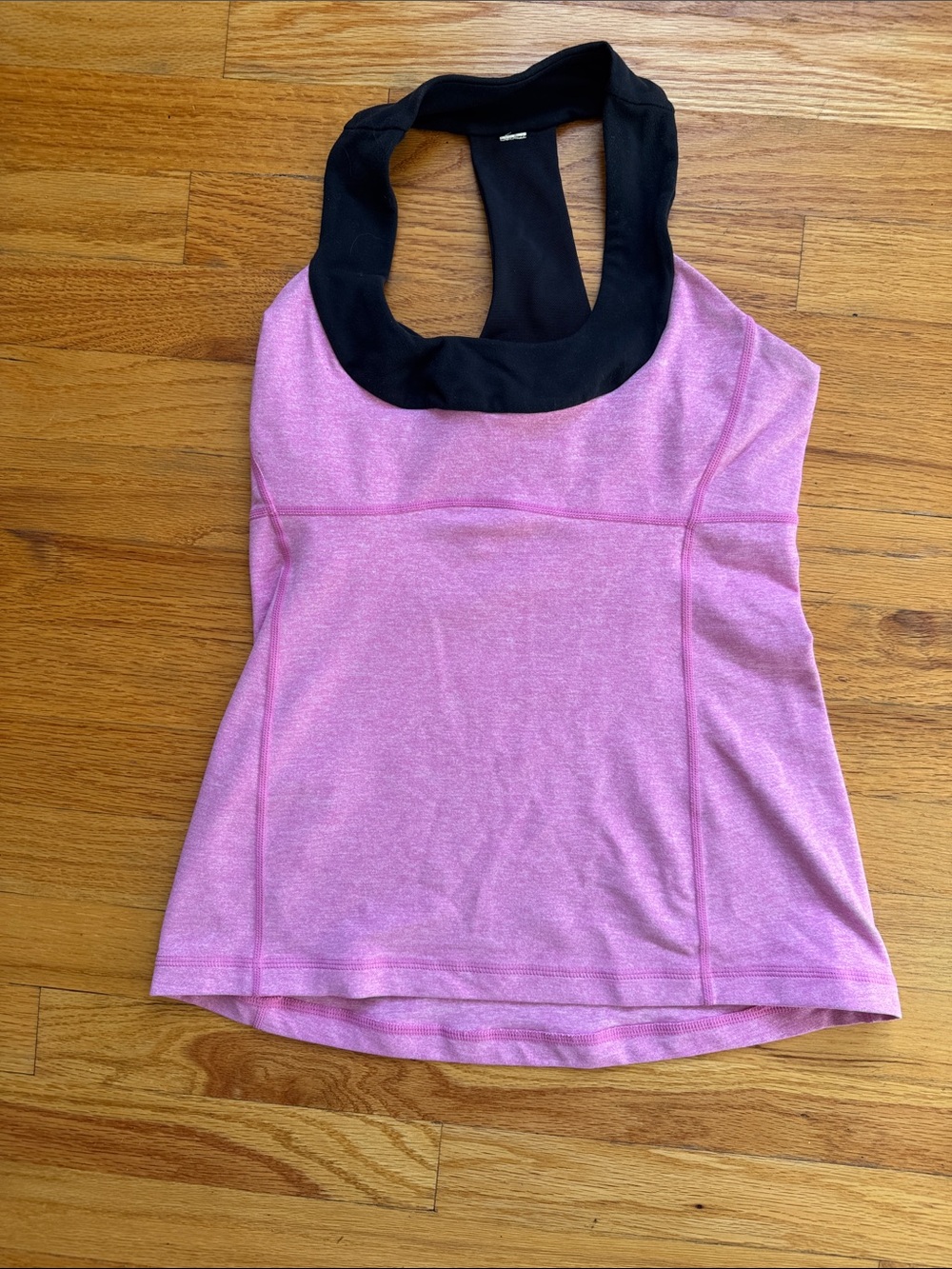 Pink Lululemon workout T-tank with black accent. Size M